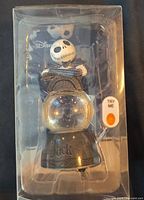Front view of boxed Disney Jack Skellington light-up snow globe