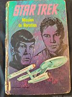 Front cover showing title, artwork, wear along spine