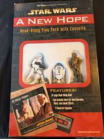Front of sealed Star Wars A New Hope Read-Along Play Pack showing cassette, booklet and three figurines