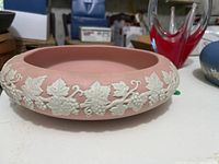 Pink jasperware-style bowl showing grapevine relief