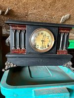 Front view showing overall form, dial, columns, and feet