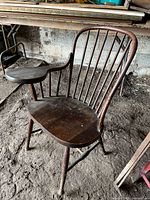 Full front view of Windsor chair showing spindle back and writing arm