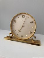 Full view of brass Imhof clock front