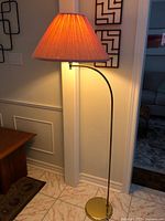 Lamp illuminated with shade glowing, full height visible