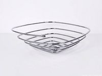 angled view showing square spiral chrome wire basket