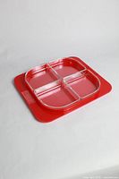 angled view of red tray with four clear bowls assembled