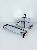 Both trays shown together displaying relative size and design