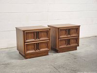 Pair of oak Spanish Revival nightstands front view