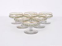 Six cordial glasses arranged in staggered formation