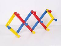 Angled view of accordion rack partially expanded showing colors and peg hooks