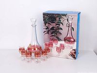 Box, decanter, six glasses displayed