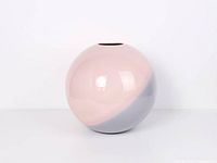 Front view of spherical pink and blue-grey vase