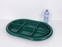 Tray with all six inserts assembled alongside water bottle for scale