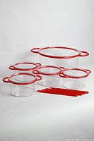 Full set showing large bowl, four small bowls, and four forks