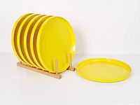 All six plates displayed on rack with one plate in front