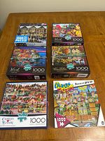 All six puzzle boxes laid out on table