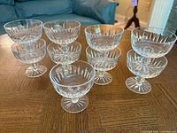 All nine crystal coupes arranged on table showing overall condition and matching design