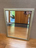 Full view of mirror front showing frame and glass