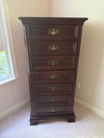 Front view of mahogany seven-drawer tall chest