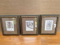 All three framed prints side by side on floor
