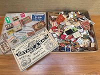 closed and open cardboard box filled with vintage matchbox labels, Bryant & May lid visible