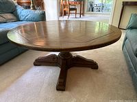 Table at low coffee-table height between sofas