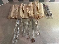 Nine wrapped packages and one unwrapped set displayed