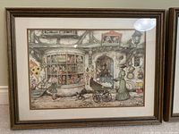 Framed toy-shop street scene print by Anton Pieck