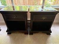 Front view of both bedside tables showing style, hardware and finish