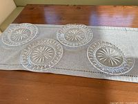 All four Waterford Starburst plates on table runner