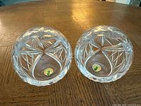 Two Waterford crystal tealight holders showing overall form and cut pattern