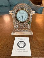 Front view of Waterford lead crystal carriage clock with operations manual