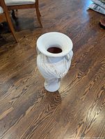 Full view of vase showing height, flared rim and distressed finish