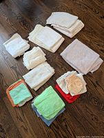 All cloths laid out in stacks on floor