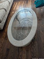 Top view showing oval shape, glass inset and marble ring