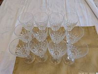 Top view showing starburst cut pattern inside bowls of all 12 glasses