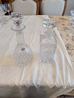Both crystal decanters side by side