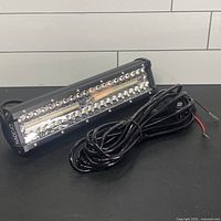 Front and side view of LED light bar with attached wiring