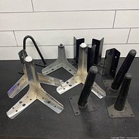 Group view of all metal furniture legs and brackets