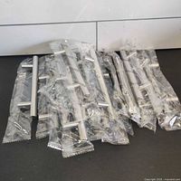 Group of 15 sealed stainless handles with screws