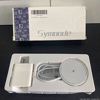 Retail box showing Symoode branding and tray with charger, cable and power adapter