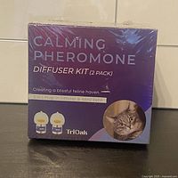 Front of sealed TriOak Calming Pheromone Diffuser Kit box