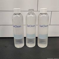 Front view of three sealed SoClean Neutralizing Pre-Wash bottles