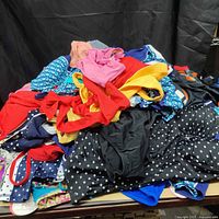 Pile of assorted women’s swimwear showing variety of styles and colors