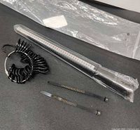 Overall lot showing mandrel, ring sizer set, two belt gauges