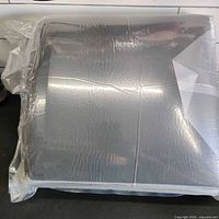 sealed stack of foam panels in clear plastic