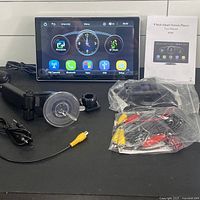 Full lot: screen, mount, power cable, backup camera, cabling, manual