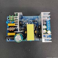 Top view of switching power supply board showing transformer, heatsinks and board markings