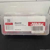 Front of sealed JGbike bleed kit case with label