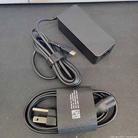 Full view of Lenovo 45W USB-C adapter with bundled AC cord